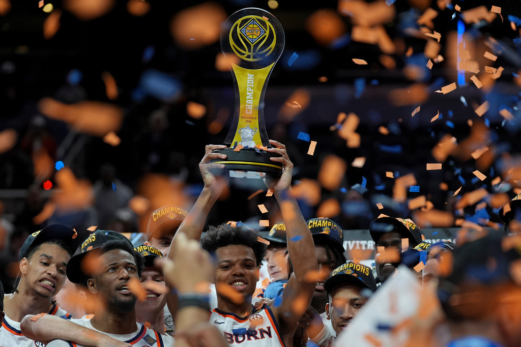 Auburn guard Keyshawn Hall holds the trophy after the NCAA college basketball NIT Championship game against Tulsa, Sunday, April 5, 2026, in Indianapolis. (AP Photo/Abbie Parr)