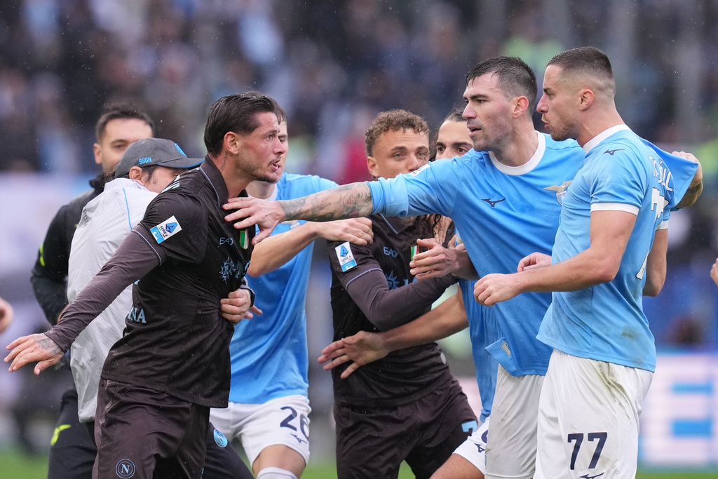 Napoli's Pasquale Mazzocchi, left, and Lazio's Adam Marusic during the Italian Serie A soccer match between SS Lazio and SSC Napoli in Rome, Sunday, Jan. 4, 2026. (Fabrizio Corradetti/LaPresse via AP)