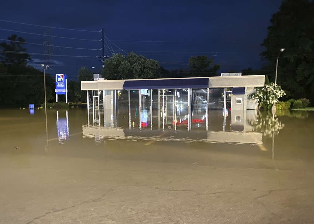 The East Brainerd branch of First Horizon Bank is flooded by the waters of Mackey Branch, in Chattanooga, Tenn., on Aug. 12, 2025. (Robin Rudd/Chattanooga Times Free Press via AP)