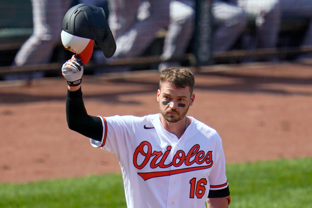 FILE - Baltimore Orioles' Trey Mancini tips his helmet as fans give him a standing ovation prior to a baseball game against the Boston Red Sox, April 8, 2021, on Opening Day in Baltimore. (AP Photo/Julio Cortez, File)