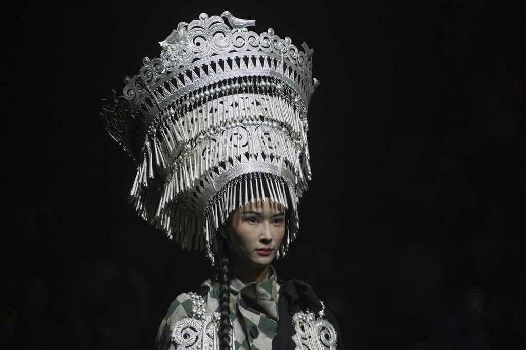 A model presents a creation from the WuMeng Village collection by Si Pu during the SS2026 China Fashion Week in Beijing, China, Tuesday, Sept. 9, 2025. (AP Photo/Andy Wong)