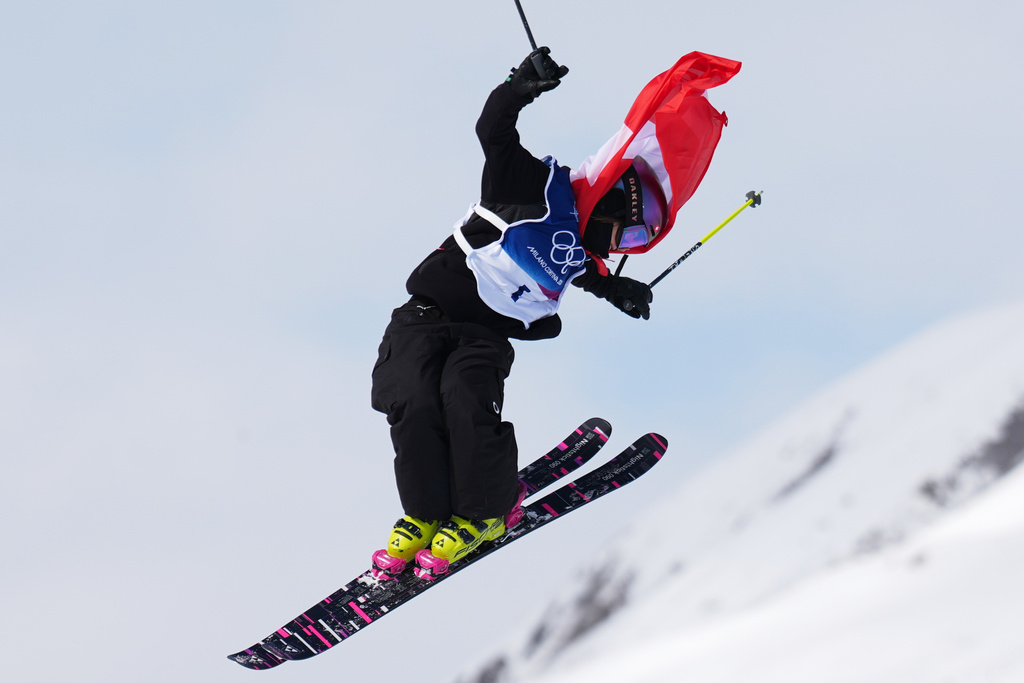 Switzerland's Mathilde Gremaud celebrates her gold medal on her final run in the women's freestyle skiing slopestyle finals at the 2026 Winter Olympics, in Livigno, Italy, Monday, Feb. 9, 2026. (AP Photo/Abbie Parr)