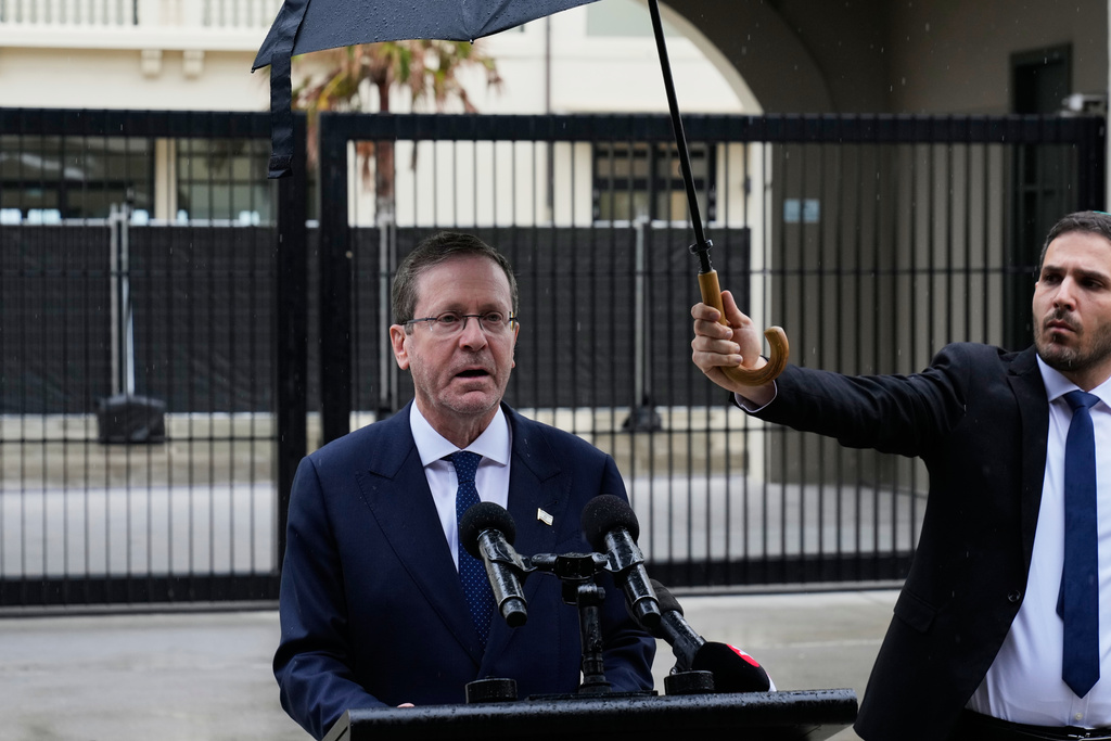 Israel's President Isaac Herzog speaks during his visit to Bondi Beach where the Dec. 2025 shooting took place, in Sydney, Monday, Feb. 9, 2026. (AP Photo/Rick Rycroft)