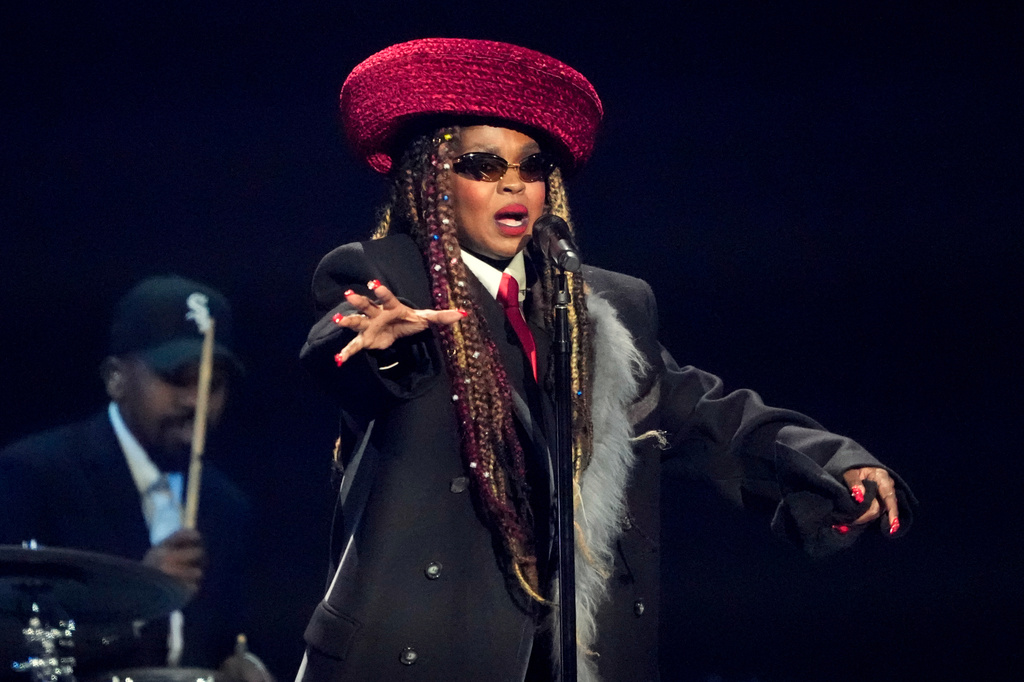 FILE - Singer Lauryn Hill performs during the draw for the 2026 soccer World Cup at the Kennedy Center in Washington, Dec. 5, 2025. (AP Photo/Chris Carlson, File)