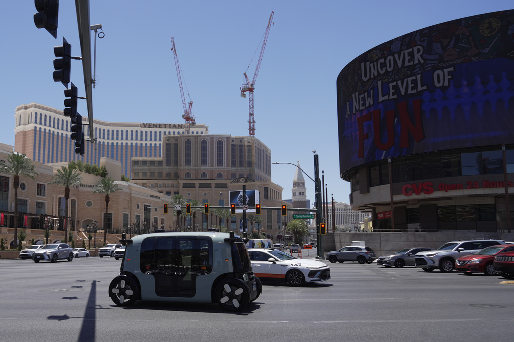 A Zoox taxi with no steering wheel drives down the Las Vegas strip on Thursday, July 30, 2026 (AP photo/Ty ONeil)