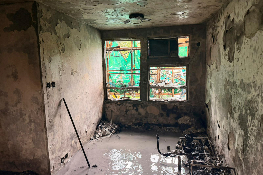 In this photo released by Hong Kong Police Public Relations Branch, the view of a burnt out apartment is seen in the aftermath of a deadly Wednesday fire at Wang Fuk Court, a residential estate in the Tai Po district of Hong Kong's New Territorie Sunday, Nov. 30, 2025. (Hong Kong Police Public Relations Branch via AP)