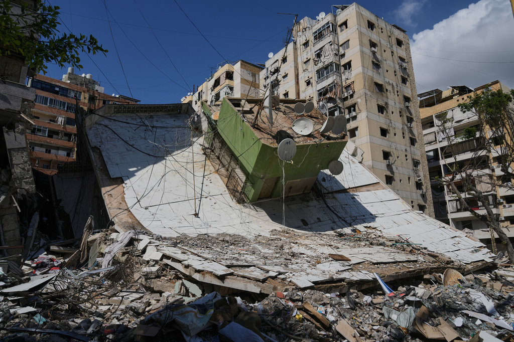 A building destroyed in a previous Israeli airstrike is seen in Dahiyeh, Beirut's southern suburbs, Lebanon, Wednesday, May 6, 2026. (AP Photo/Bilal Hussein)