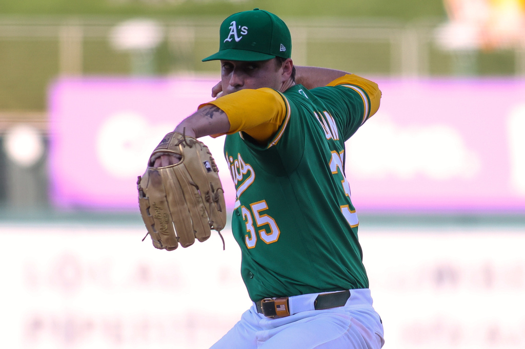 Athletics pitcher J.T. Ginn throws to a Pittsburgh Pirates batter during the first inning of a baseball game Monday, June 15, 2026, in West Sacramento, Calif. (AP Photo/Scott Marshall)