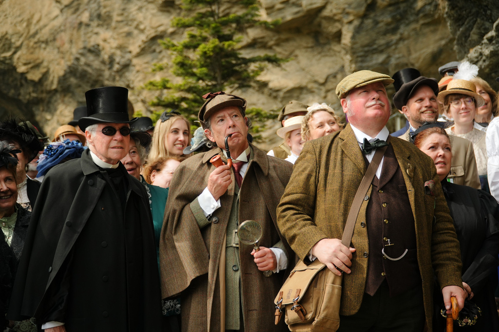 From left: Peter Horrocks, as Professor Moriarty, Philip Porter as Sherlock Holmes. and Charles Miller, as Doctor Watson, during an event recreating the fateful confrontation between Sherlock Holmes and Professor Moriarty by the members of the Sherlock Holmes Society of London, at the Reichenbach Falls, Switzerland, May 3, 2026. (AP Photo/Niccolo Lupone, Pool)