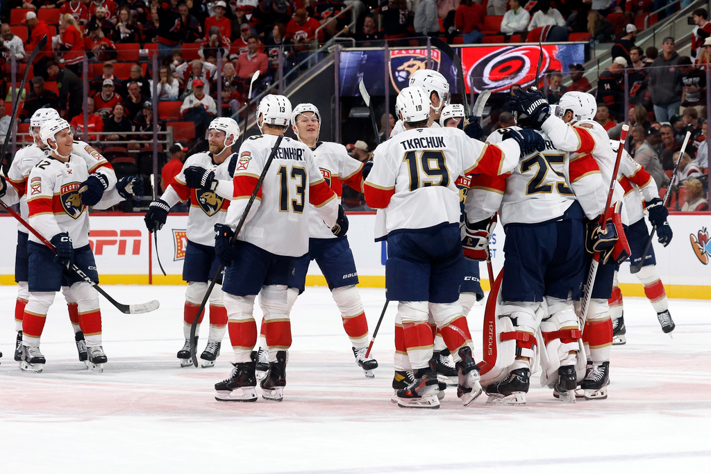 Florida Panthers celebrate their 2-1 win over the Carolina Hurricanes following an NHL hockey game in Raleigh, N.C., Tuesday, Sept. 29, 2026. (AP Photo/Karl DeBlaker)
