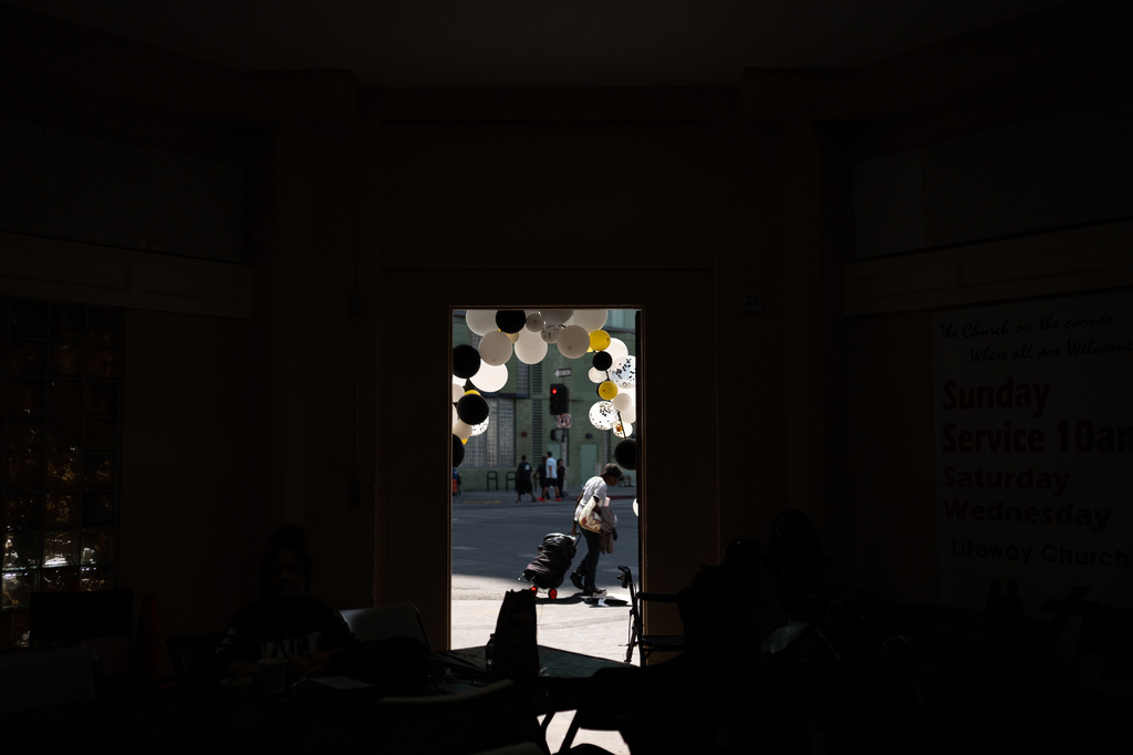 A person walks past the entrance to Lifeway Church, decorated with balloons for Skid Row's inaugural talent show in downtown Los Angeles, Saturday, Sept. 19, 2026. (AP Photo/Jae C. Hong)
