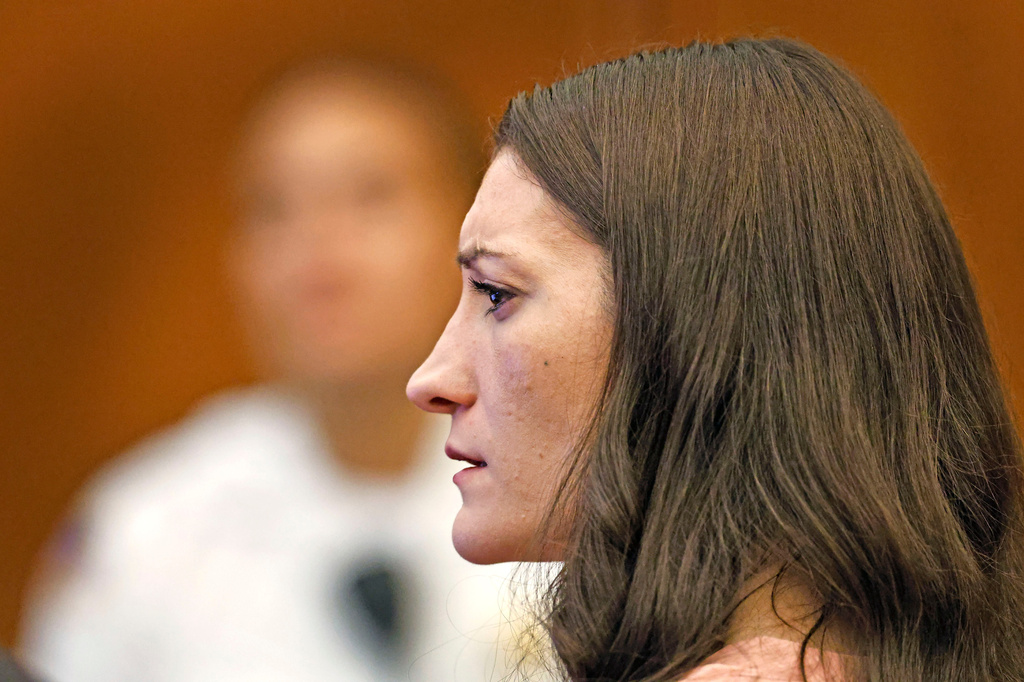 Defendant Lindsay Clancy watches as her ex husband Patrick Clancy takes the witness stand at Plymouth Superior Court in Plymouth, Mass., Monday, July 27, 2026. (Greg Derr/The Patriot Ledger via AP, Pool)
