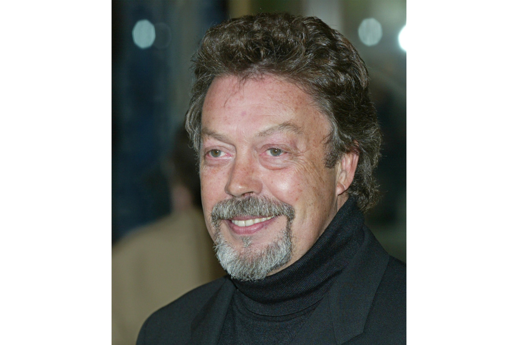 FILE - Actor Tim Curry appears at the Film Society of Lincoln Center's gala tribute to actress Susan Sarandon in New York on May 5, 2003. (AP Photo/Stuart Ramson, File)