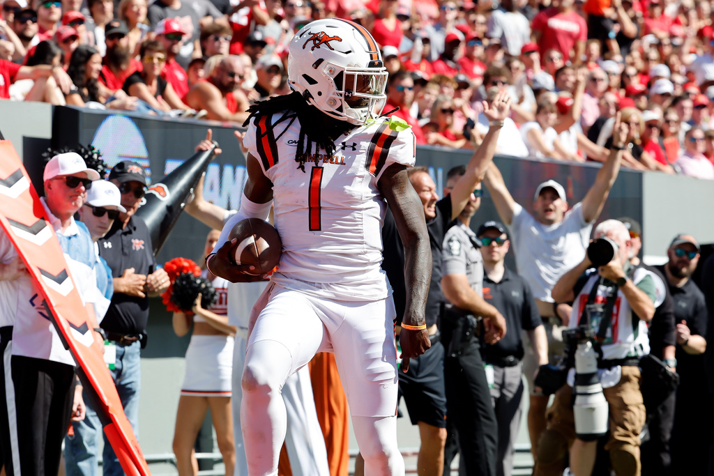 Campbell quarterback Mike Chandler II (1) is seen after scoring a touchdown against North Carolina State during the first half of an NCAA college football game in Raleigh, N.C., Saturday, Oct. 4, 2025. (AP Photo/Karl DeBlaker)