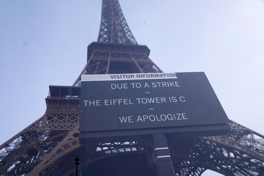 A board at the closed Eiffel Tower during a new round of strikes and protests to denounce spending cuts and demand higher taxes on the rich Thursday, Oct. 2, 2025 in Paris. (AP Photo/Michel Euler)