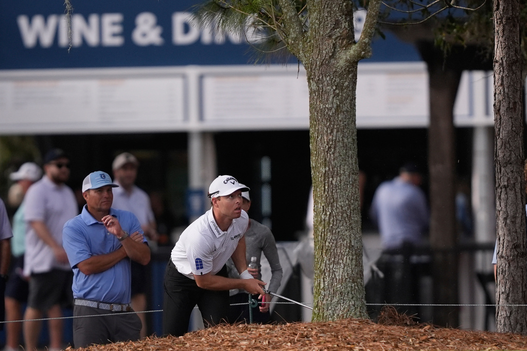 Max Greyserman watches his shot on the 9th hole during the first round of The Players Championship golf tournament Thursday, March 12, 2026, in Ponte Bedra Beach, Fla. (AP Photo/Gerald Herbert)