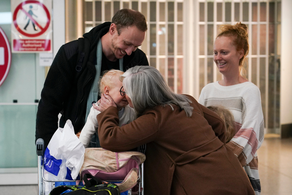 Passengers arrive at Stansted Airport in Stansted, England, Friday, March 6, 2026 on a Government-chartered plane from Muscat, Oman. (AP Photo/Alberto Pezzali)