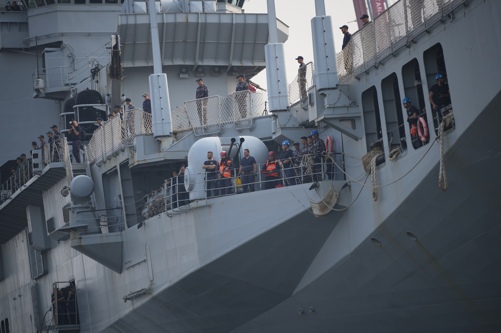 Indonesian Navy personnel and crew members stand aboard the Giuseppe Garibaldi, a former Italian Navy aircraft carrier, after its arrival at Tanjung Priok port in Jakarta, Indonesia, Friday, Sept. 18, 2026. (AP Photo/Tatan Syuflana)