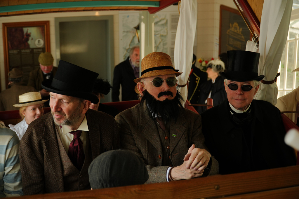 From left: Robert Hutton, as Colonel Valentine Walter, Rick Grandia as Robert Carruthers and Peter Horrocks, as Professor Moriarty, during an event recreating the fateful confrontation between Sherlock Holmes and Professor Moriarty by the members of the Sherlock Holmes Society of London, at the Reichenbach Falls, Switzerland, May 3, 2026. (AP Photo/Niccolo Lupone, Pool)