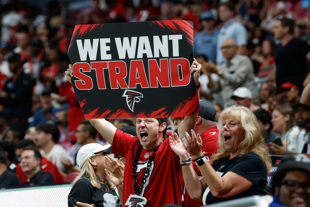 Atlanta Falcons fans hold up a sign "We Want Strand" for Atlanta Falcons quarterback Jack Strand (18) during an NFL football game in Atlanta, Sunday, Sept. 20, 2026. (AP Photo/Erik S. Lesser)