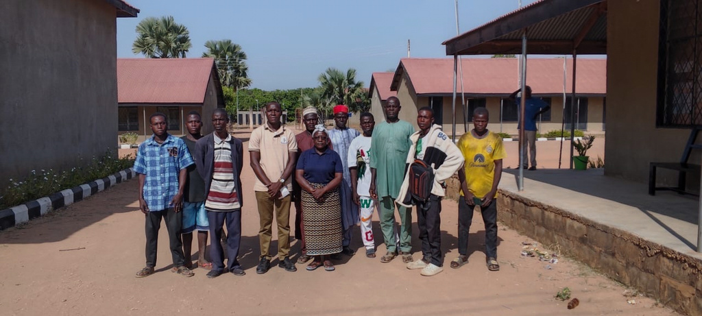 In this photo released by Christian Association of Nigeria, people pose for a photograph at St. Mary's Catholic Primary and Secondary School after gunmen abducted children and staff in Papiri community, Nigeria, Friday, Nov. 21, 2025. (Christian Association of Nigeria via AP)