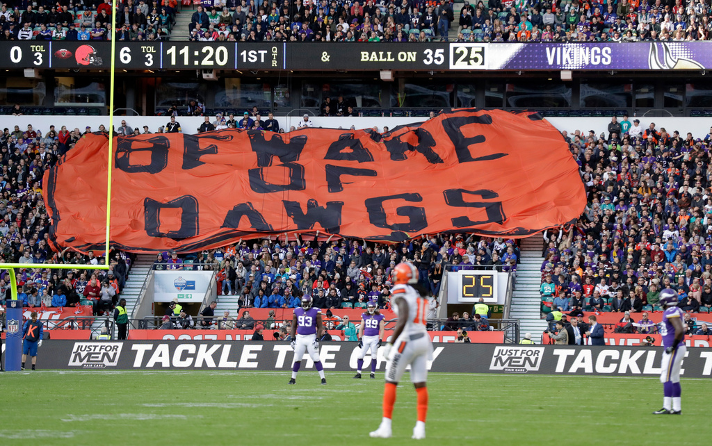 FILE - Cleveland Browns supporters unfurl a giant banner during the first half of an NFL football game against Minnesota Vikings at Twickenham Stadium in London, Oct. 29, 2017. (AP Photo/Matt Dunham, File)