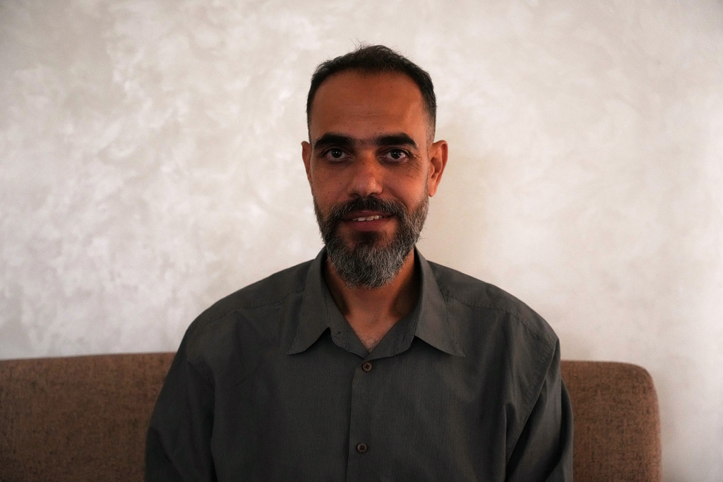 Palestinian medical technician Mohammed Abu Moussa, 45, who was released from Israeli detention after 20 months, poses for a photo in Deir al-Balah, Gaza, Saturday, Oct, 18, 2025. (AP Photo/Abdel Kareem Hana)