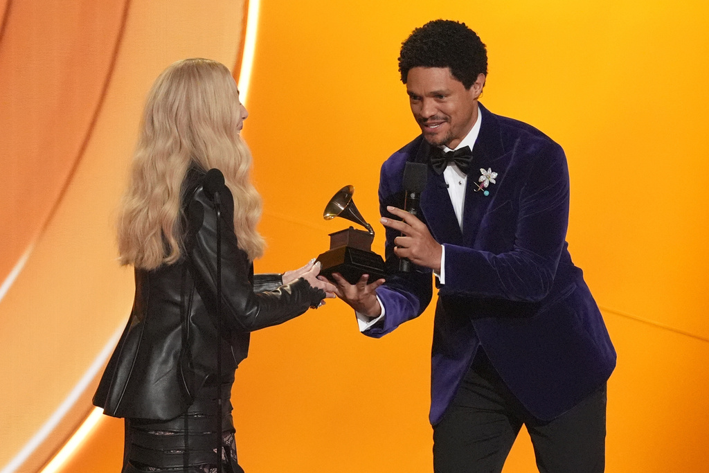 Host Trevor Noah, right, presents Cher with the lifetime achievement award during the 68th annual Grammy Awards on Sunday, Feb. 1, 2026, in Los Angeles. (AP Photo/Chris Pizzello)
