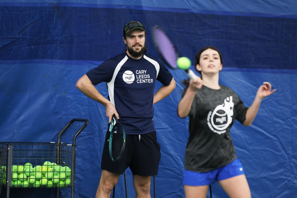 Coach Robert Cizek looks on as Mariia Vainshtein participates in drills during tennis practice at the Cary Leeds Center for Tennis and Learning in the Bronx borough of New York, Saturday, Jan. 31, 2026. (AP Photo/Heather Khalifa)