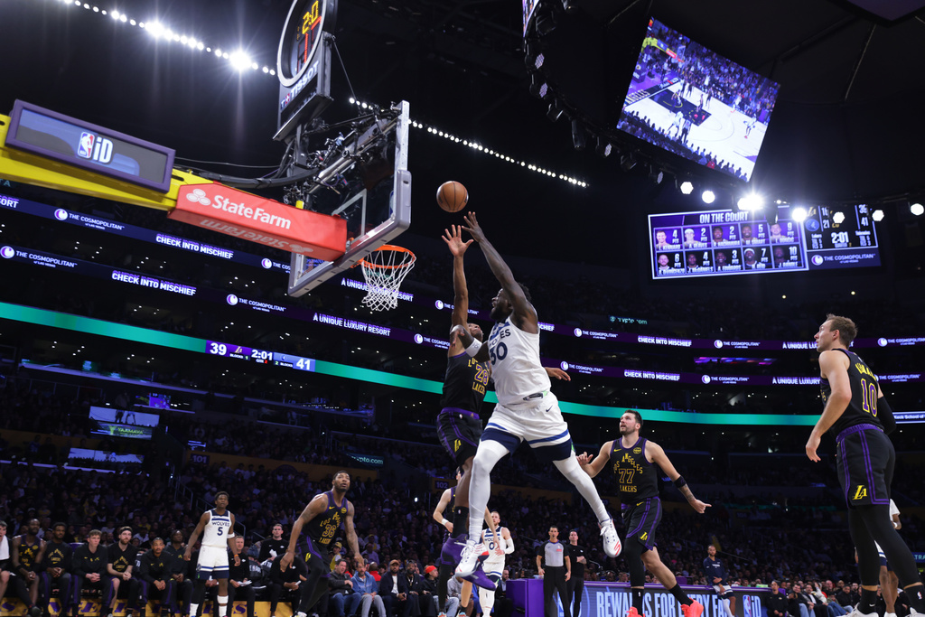 Minnesota Timberwolves forward Julius Randle (30) drives the ball against the Los Angeles Lakers during the first half of an NBA basketball game, Tuesday, March 10, 2026, in Los Angeles. (AP Photo/Ethan Swope)
