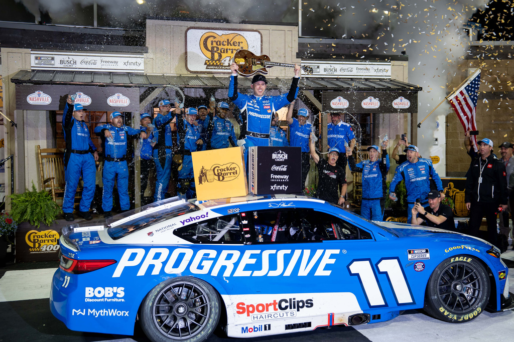 Denny Hamlin celebrates after winning a NASCAR Cup Series auto race, Sunday, May 31, 2026, in Lebanon, Tenn. (AP Photo/Camden Hall)