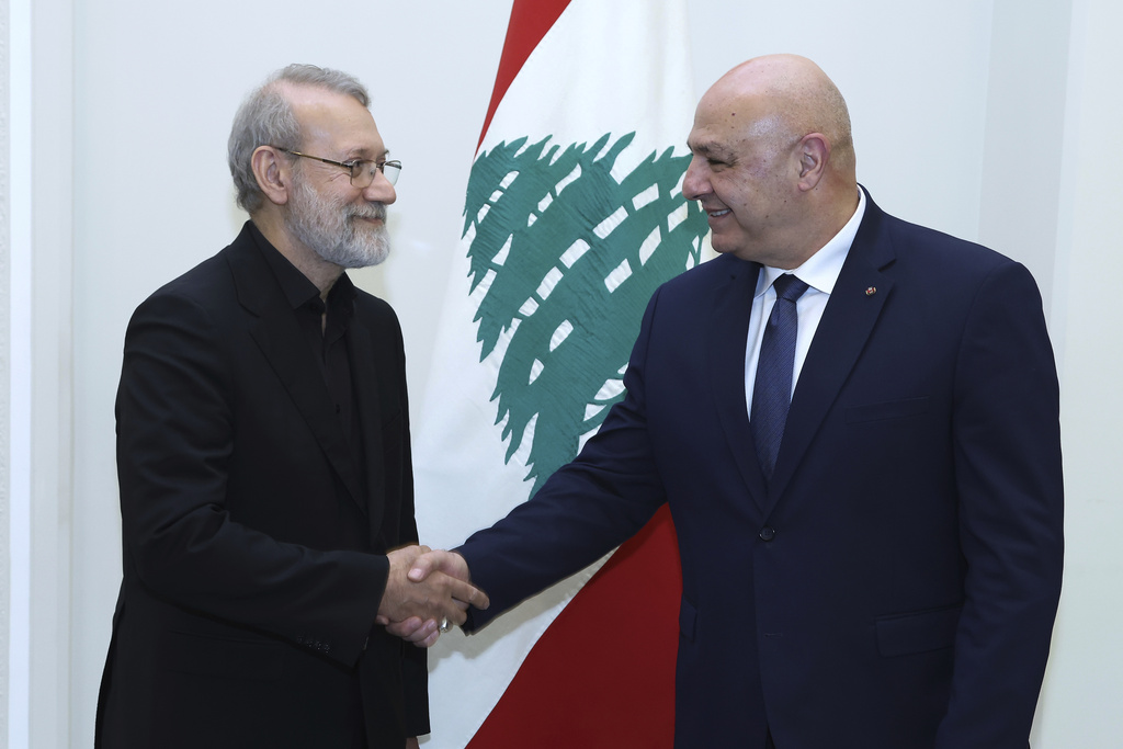 In this photo, released by the Lebanese Presidency press office, Lebanese President Joseph Aoun, right, shakes hands with Iranian Secretary of Supreme National Security Council Ali Larijani, at the presidential palace in Baabda, east of Beirut, Lebanon, Wednesday, Aug. 13, 2025. (Lebanese Presidency press office via AP)