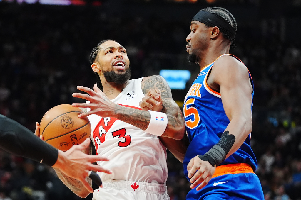 Toronto Raptors' Brandon Ingram (3) is fouled by New York Knicks' Ariel Hukporti (55) during first half NBA basketball action in Toronto on Wednesday, Jan. 28, 2026. (Frank Gunn/The Canadian Press via AP)