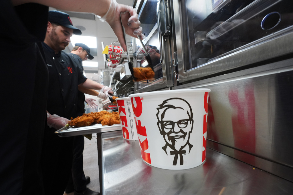 Fried chicken is placed into a bucket at a new KFC restaurant in McKinney, Texas, Tuesday, Sept. 22, 2026. (AP Photo/LM Otero)