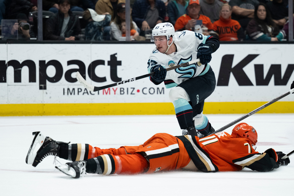 Anaheim Ducks defenseman Ian Moore (74) blocks the shot by Seattle Kraken right wing Jacob Melanson (63) during the second period of an NHL hockey game, Tuesday, Feb. 3, 2026, in Anaheim, Calif. (AP Photo/Kyusung Gong)