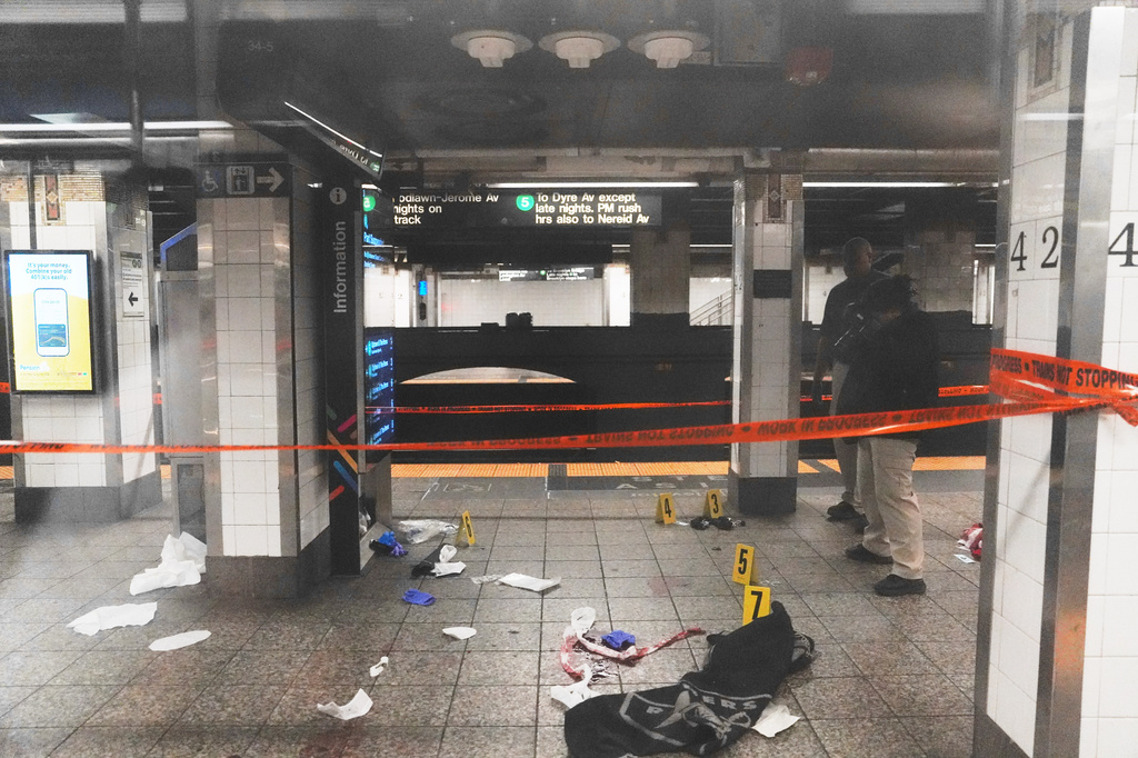 Police investigate the scene after a reported stabbing and shooting at the Grand Central subway station in New York on Saturday, April 11, 2026. (AP Photo/Ryan Murphy)