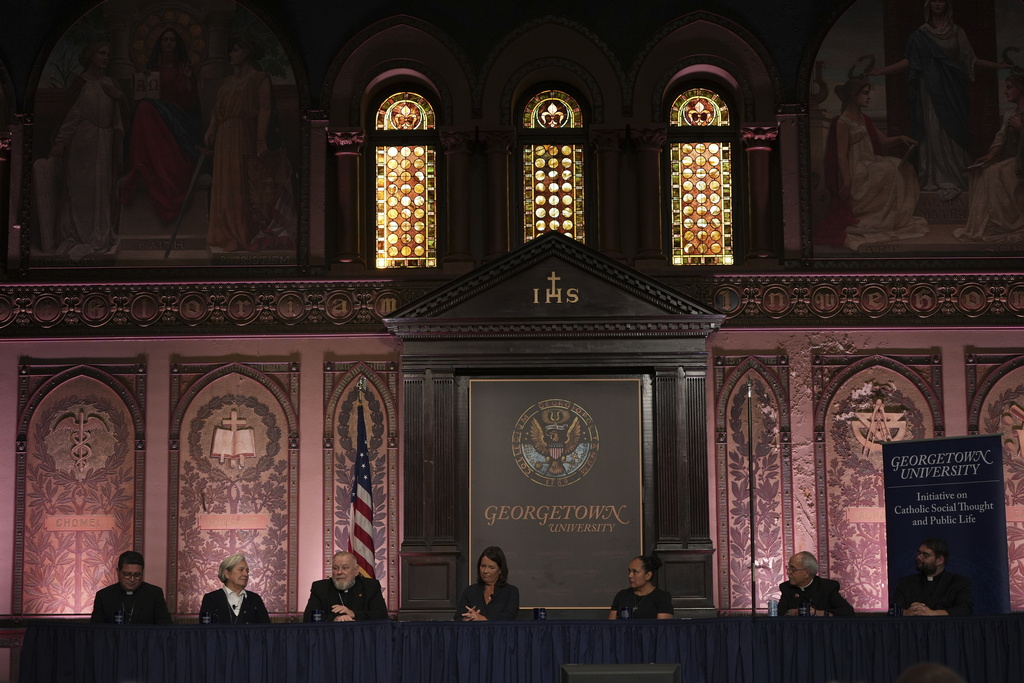 From left to right, Auxiliary Bishop Evelio Menjivar-Ayala of Washington, D.C.; Sister Norma Pimentel; Archbishop Thomas Wenski of Miami; panel moderator Kim Daniels; Nicole Flores, a religious studies professor at University of Virginia; Mark Seitz, bishop of El Paso, Texas; and the Rev. Guillermo Treviño, Jr., attend a panel at Georgetown University in Washington, Thursday, Sept. 11, 2025. (AP Photo/Luis Andres Henao)