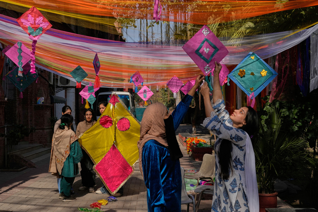 Students decorate their university campus with variety of kites ahead of the upcoming three-day kite flying festival 'Basant' celebrations, in Lahore, Pakistan, Thursday, Feb. 5, 2026. (AP Photo/K.M. Chaudary)