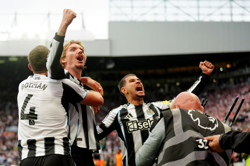 Newcastle United's Nick Woltemade celebrates scoring their side's first goal of the game during their English Premier League soccer match against Arsenal at St. James' Park, Newcastle upon Tyne, England, Sunday, Sept. 28, 2025. (Owen Humphreys/PA via AP)