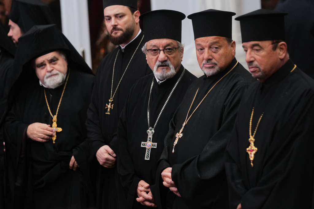 Orthodox clerics wait for Pope Leo XIV to arrive for a doxology service at the Patriarchal Church of Saint George, in Istanbul, Turkey, Saturday, Nov. 29, 2025. (AP Photo/Francisco Seco)
