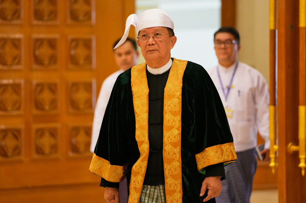 Parliament chairman Aung Lin Dwe, center, arrives to lead a regular session of the Union Parliament in Naypyitaw, Myanmar, Friday, July 31, 2026. (AP Photo/Aung Shine Oo)