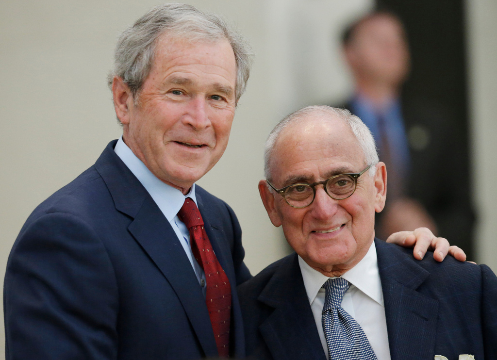 FILE - Former President George W. Bush, left, and center architect Robert A.M. Stern pause for a photo before the signing ceremony for the joint use agreement between the National Archive and the George W. Bush Presidential Center Wednesday, April 24, 2013, in Dallas. (AP Photo/David J. Phillip, File)