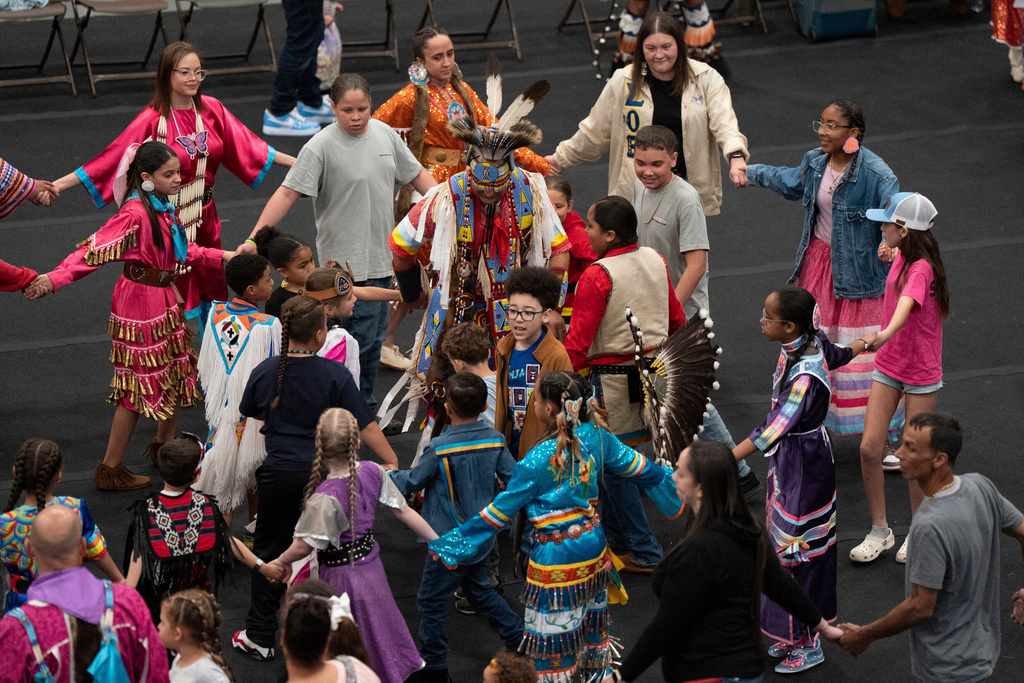 FILE - People participate during the BraveNation Powwow and Gather at UNC Pembroke, March 22, 2025, in Pembroke, N.C. (AP Photo/Allison Joyce, File)