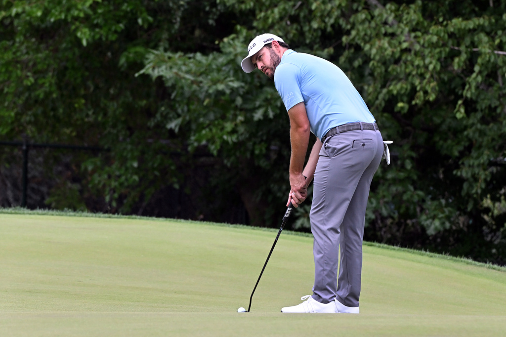 Patrick Cantlay prepares to putt on the eighth green during the first round of the Rocket Classic golf tournament at the Detroit Golf Club, Thursday, July 30, 2026, in Detroit. (AP Photo/Jose Juarez)