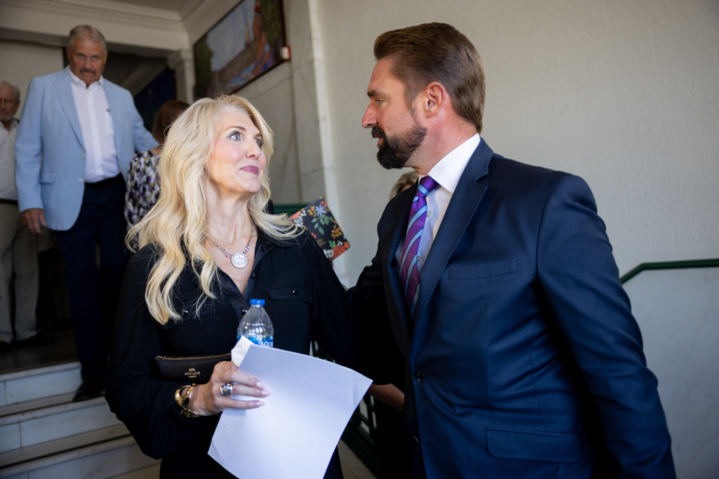 Karen Black, left, sister of Cindy Clemishire, speaks with Rep. Jeff Leach, R-Allen, following the arraignment hearing for Dallas-area megachurch Gateway founder Robert Morris at the Osage County Courthouse in Pawhuska, Okla., on Thursday, Oct. 2, 2025. (Juan Figueroa/The Dallas Morning News via AP)