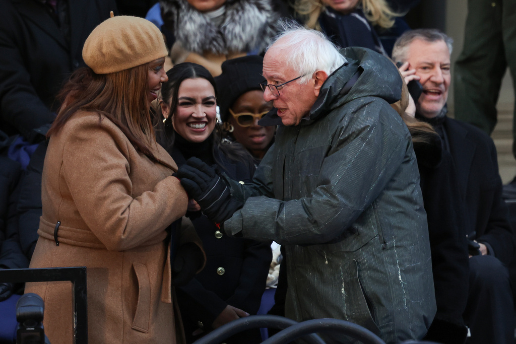 Sen. Bernie Sanders, I-Vt., right, greets New York Attorney General Letitia James before the swearing-in ceremony for Mayor Zohran Mamdani, Thursday, Jan. 1, 2026, in New York. (AP Photo/Heather Khalifa)
