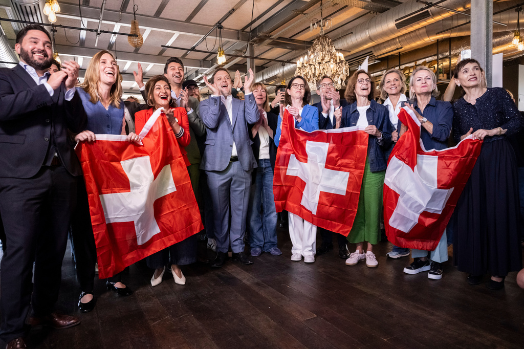 Co-President of the Swiss Social Democratic Party Cedric Wermuth, from left, along with National Council of Switzerland members Corina Gredig, Sibel Arslan, Fabian Molina, Heinz Theiler and Jon Pult, Council of States member Mathilde Crevoisier Crelier, Co-President of the FDP Susanne Vincenz-Stauffacher, National Councilor Heinz Theiler, Director of the Swiss Business Federation Monika Rühl, National Councilor Simone De Montmollin and Council of the States members Andrea Gmür and Marianne Binder-Keller gather at the campaign office for the committee opposing the neutrality initiative Sunday, Sept. 27, 2026, in Bern, Switzerland. (Alessandro della Valle/Keystone via AP)