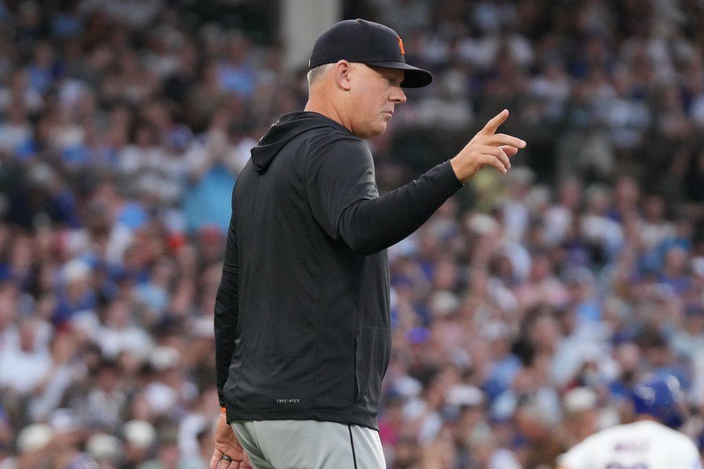 Detroit Tigers manager A.J. Hinch gestures as he makes a pitching change against the Chicago Cubs during the first inning of a baseball game Tuesday, July 21, 2026, in Chicago. (AP Photo/David Banks)