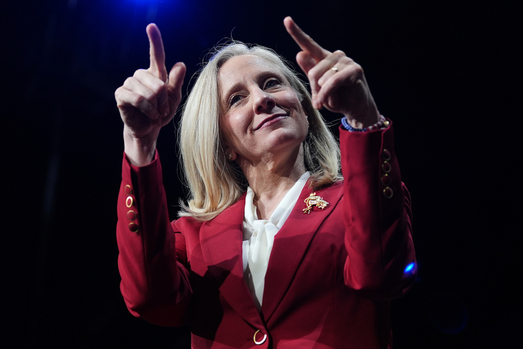 Democrat Abigail Spanberger points out at the crowd after she was declared the winner of the Virginia governor's race during an election night watch party Tuesday, Nov. 4, 2025, in Richmond, Va. (AP Photo/Stephanie Scarbrough)