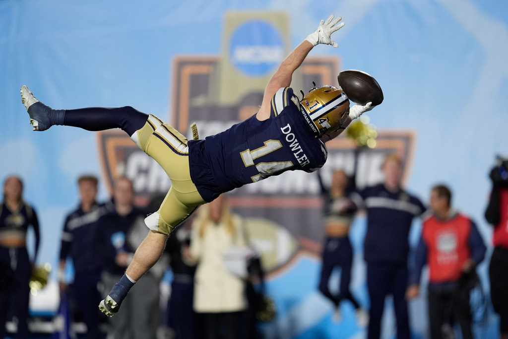 Montana State wide receiver Taco Dowler (14) dives into the end zone for a touchdown during the second half of the FCS Championship NCAA college football game against Illinois State, Monday, Jan. 5, 2026, in Nashville, Tenn. (AP Photo/George Walker IV)